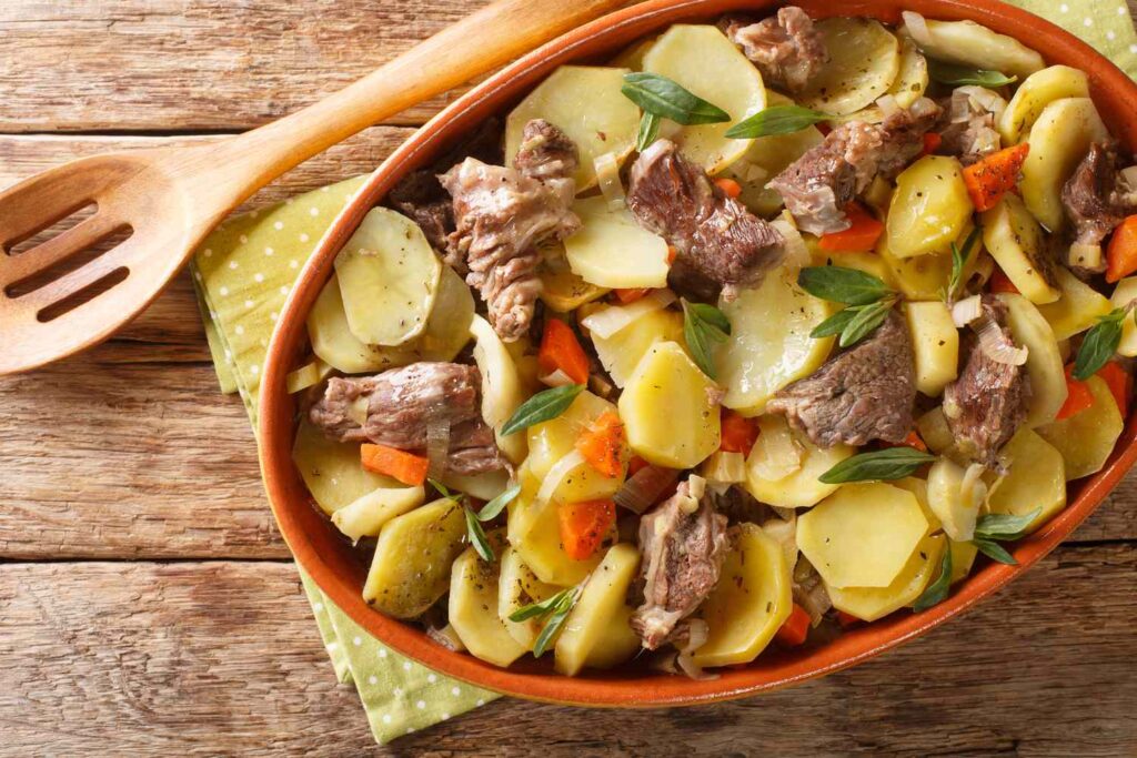 alsace-baeckeoffe-casserole-with-meat-potatoes-and-vegetables-marinated-with-white-wine-close-up-in-a-pot